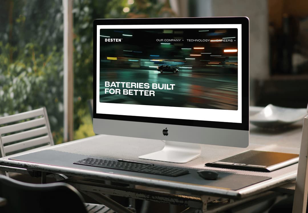 Desktop computer displaying the Desten website