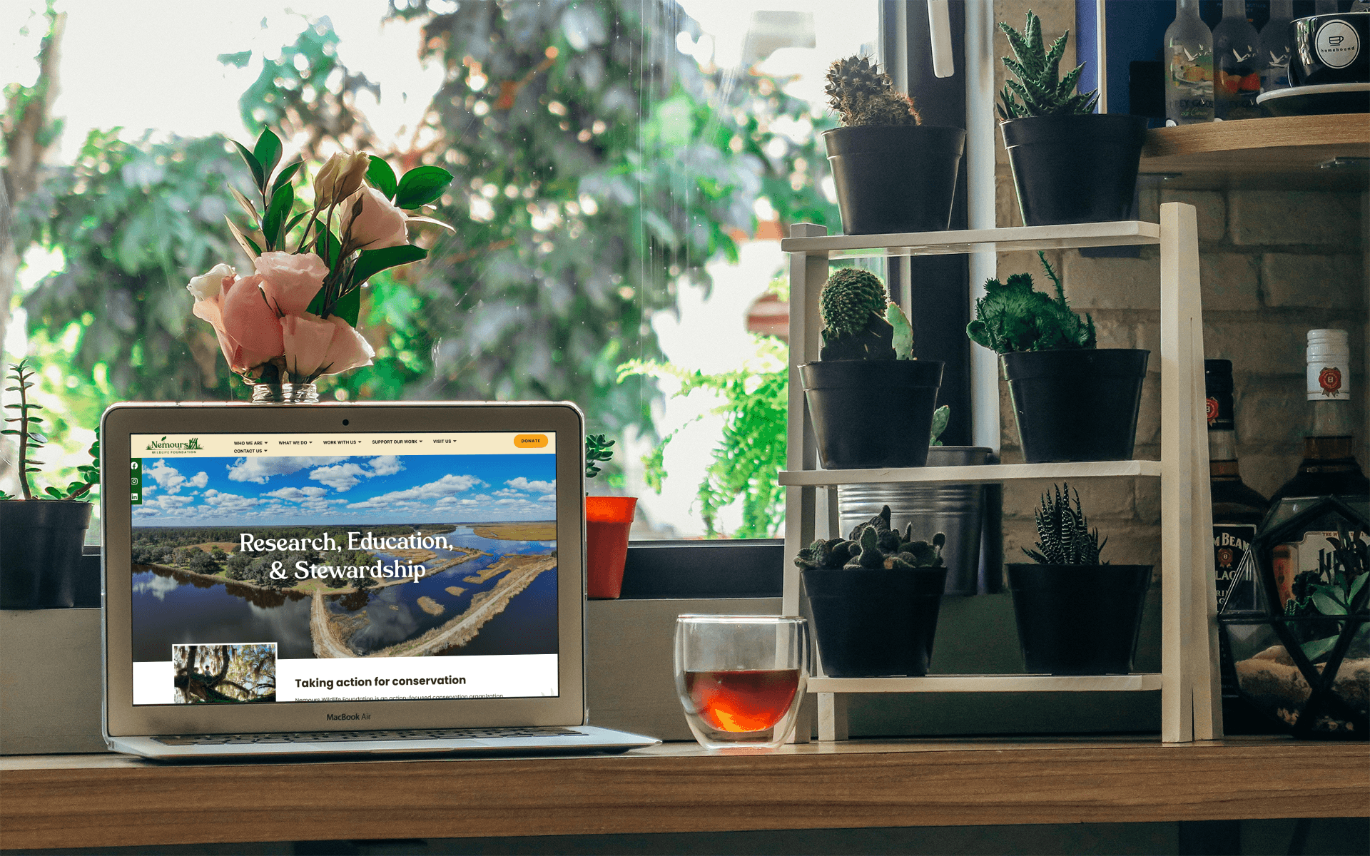 Mockup of MacBook showing website